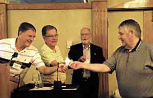 Don Schoenly, Bob Culver and Jay Kivell light the rush Meeting Planners Lighting the Rushlight